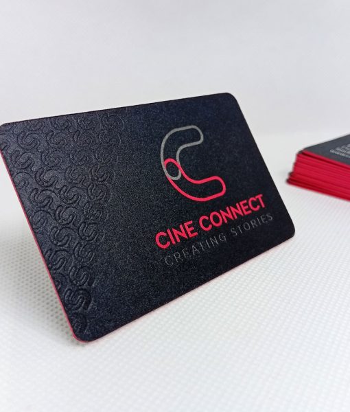 Luxury Matt Black Business Cards with the light catching the debossed pattern, letterpress logo and uncoated matt flood background print