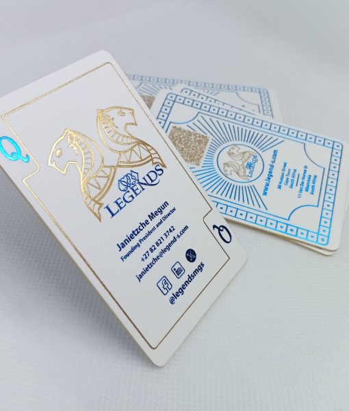 Light catching the luxury foil in the logo of the Gold and Blue Foiled Business Cards