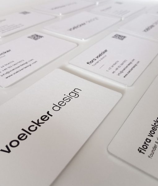 Graphic Design company logo featured on the black foil business cards
