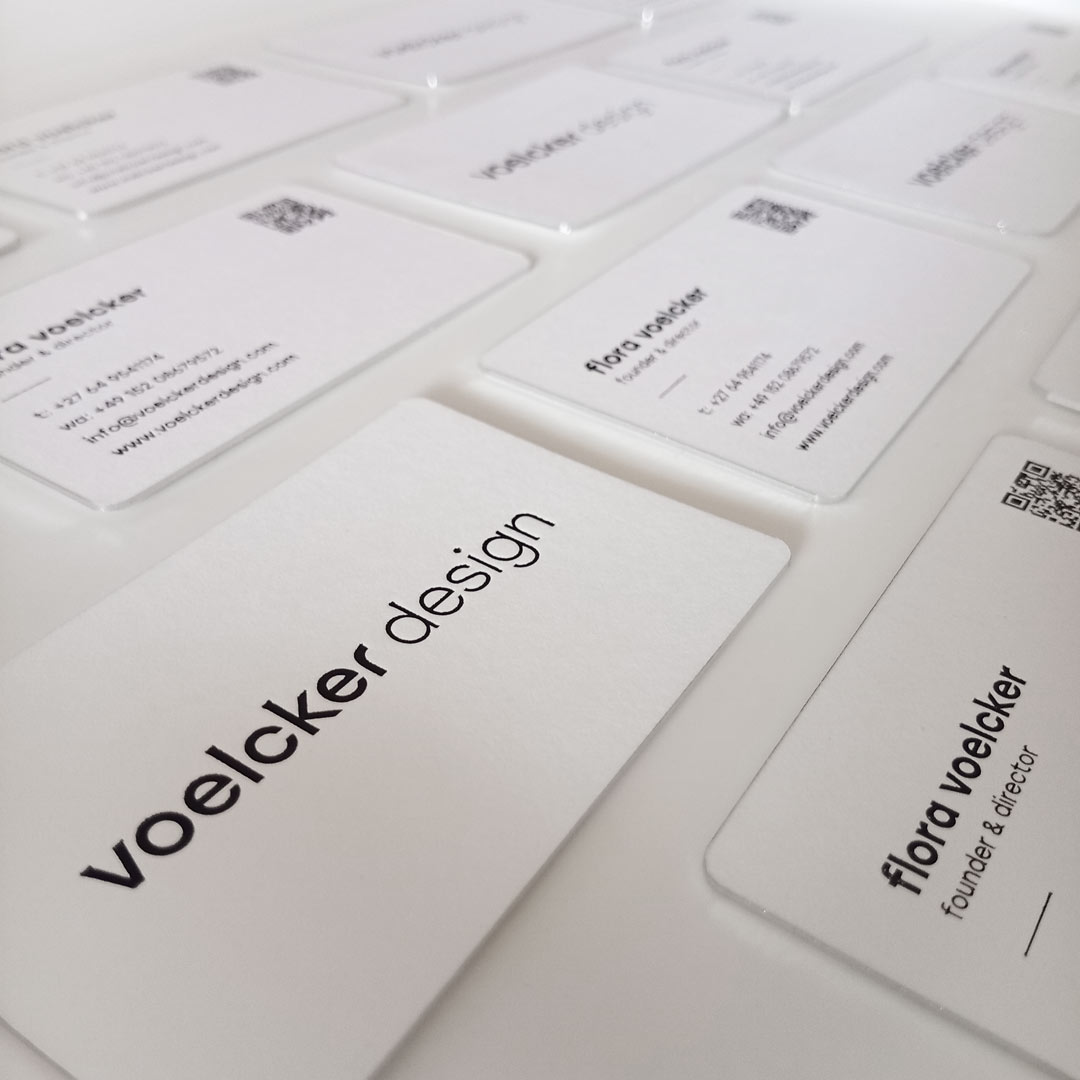 Graphic Design company logo featured on the black foil business cards