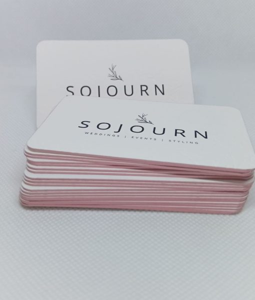 Stacked edge foiled luxury business cards with debossed pattern and letterpress logo