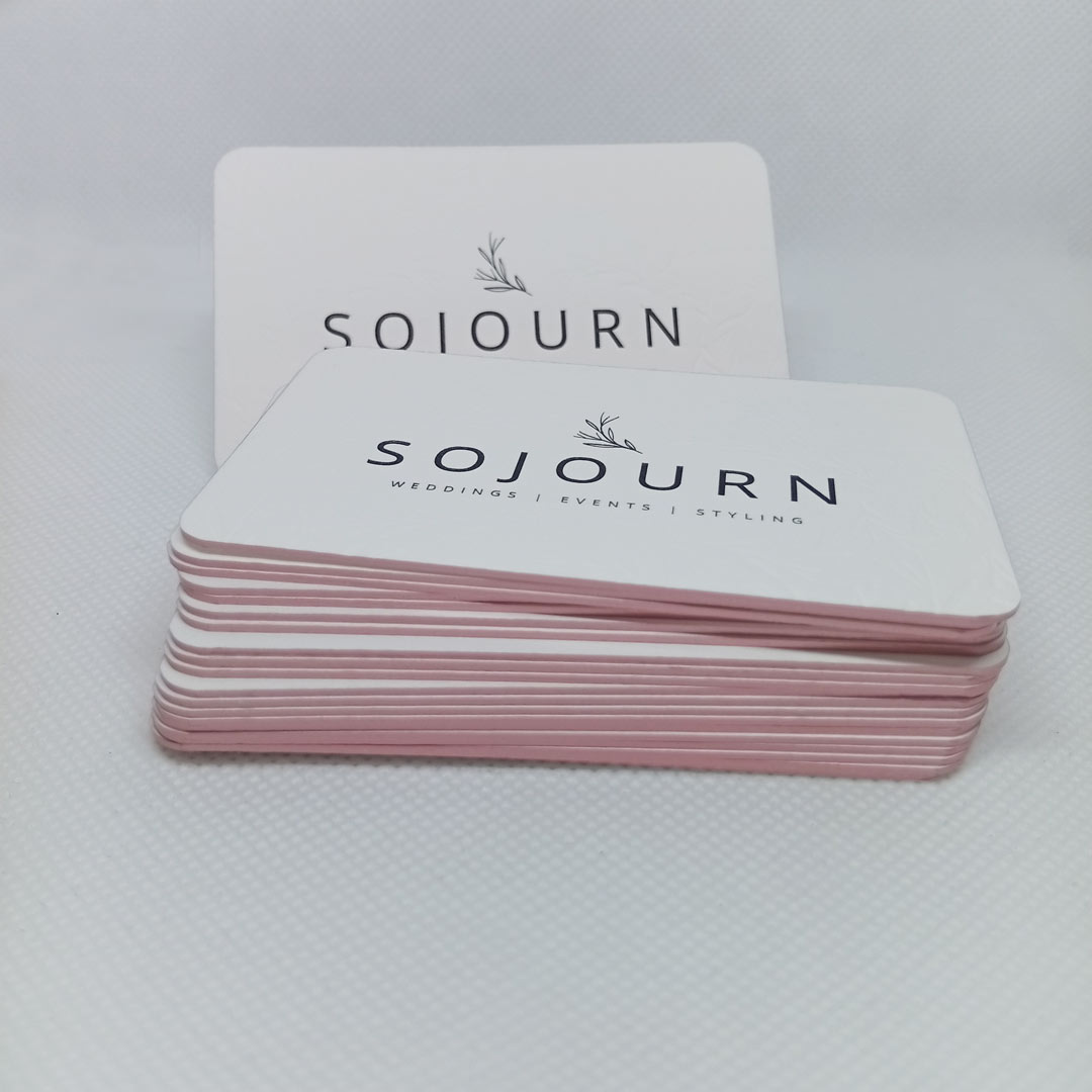 Stacked edge foiled luxury business cards with debossed pattern and letterpress logo