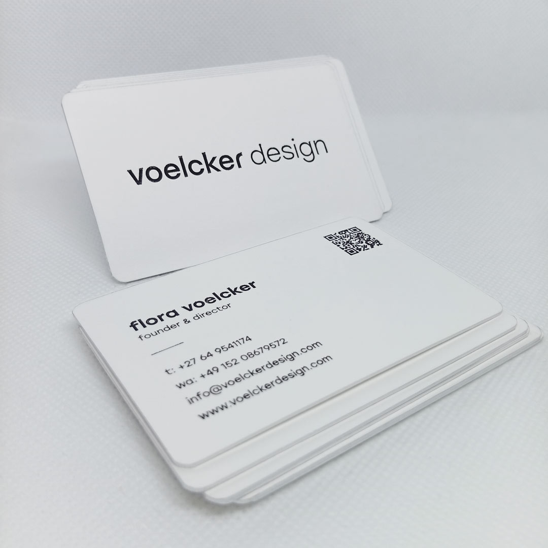 Set of monochrome luxury business cards with black foil and silver edge printing