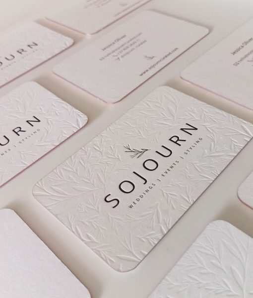 Letterpress logo and debossed pattern on these Elegant pink foil business cards
