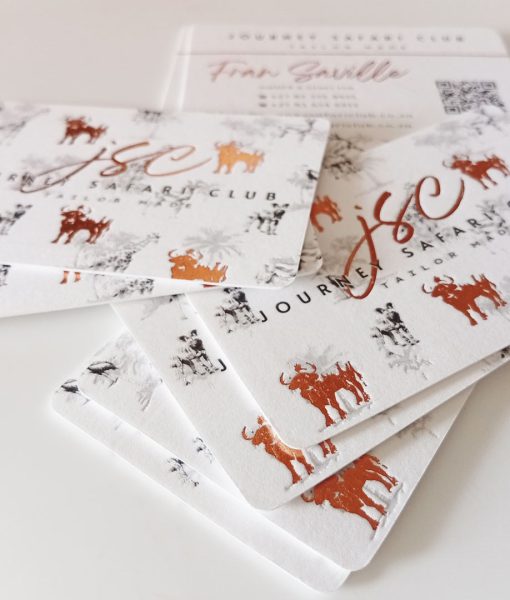Logo foiled in copper and letterpress featured on these safari luxury business cards
