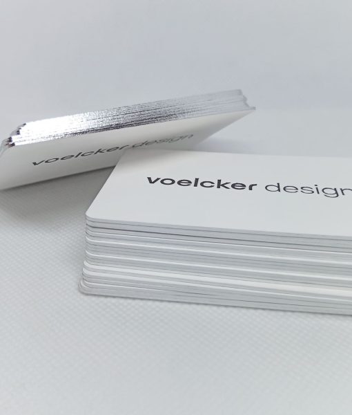 Side profile of a stack of Luxury Business Cards with shiny silver edge printed business cards