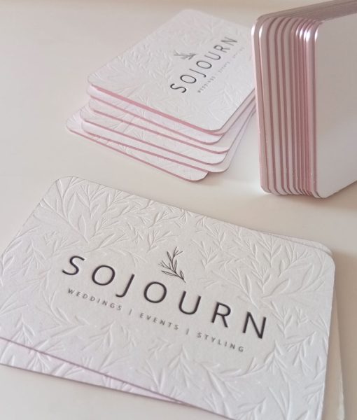 Subtle shimmer of the soft pink metallic foiled edges of these luxury business cards