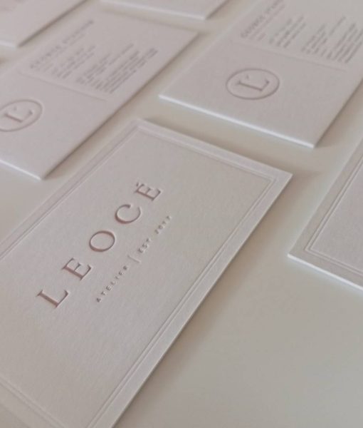 Another angled perspective shot highlighting the letterpress logo in the Leocé Luxury Business Cards