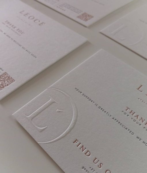Angled perspective shot of 4 of the Letterpress Debossed Monogram invitation size Thank You Cards