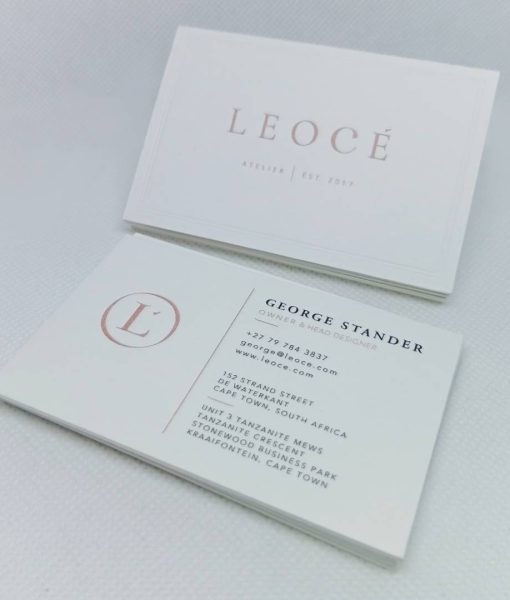 Pile of Leocé Luxury Business Cards on natural off-white natural board